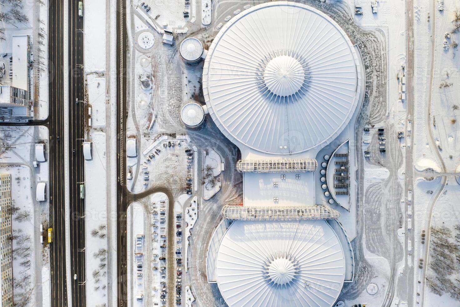 Top view in winter of a modern sports complex with parking in Minsk. Belarus photo