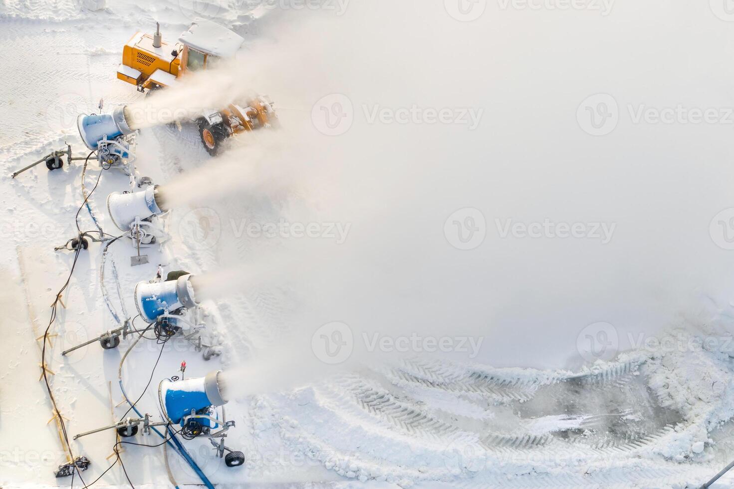 Top view of the work of four snow cannons for the production of artificial snow photo