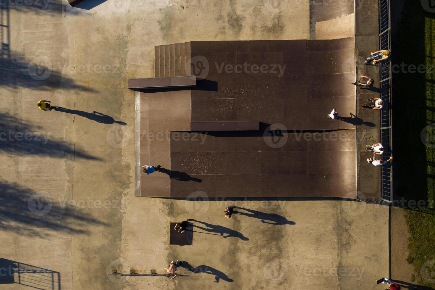 Children ride on the outdoor skateboard court.Skatepark for sports photo