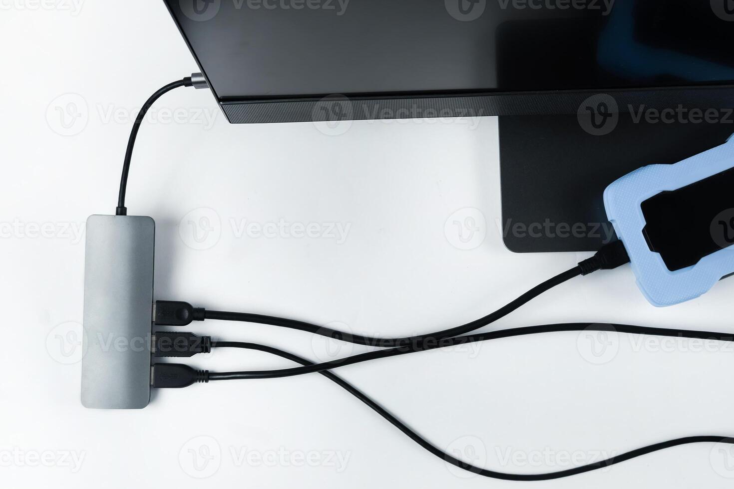 Adapter with connection of external hard drives connected to a monoblock on a white background.Computer with a hard disk photo