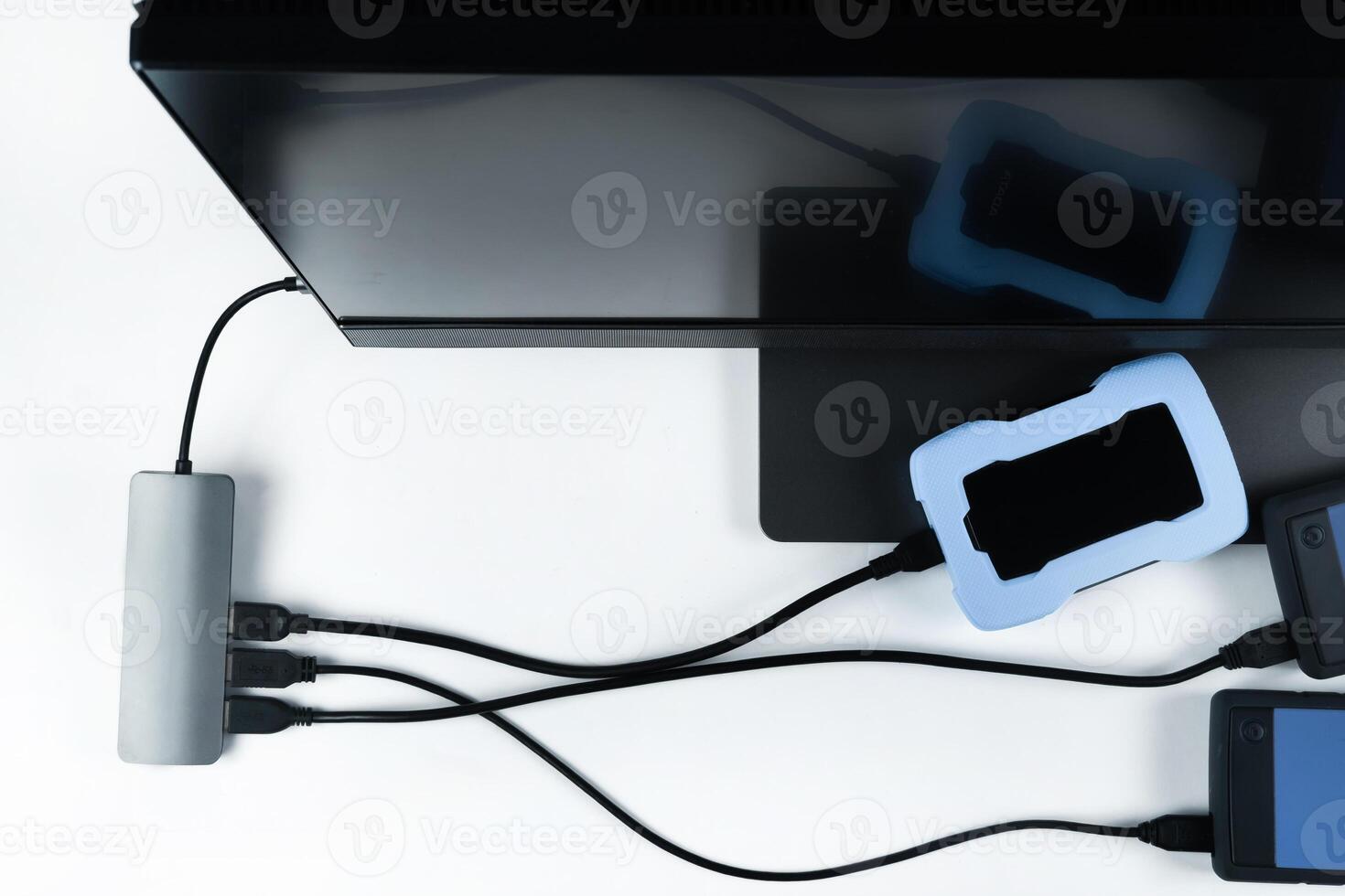 Adapter with connection of external hard drives connected to a monoblock on a white background.Computer with a hard disk photo