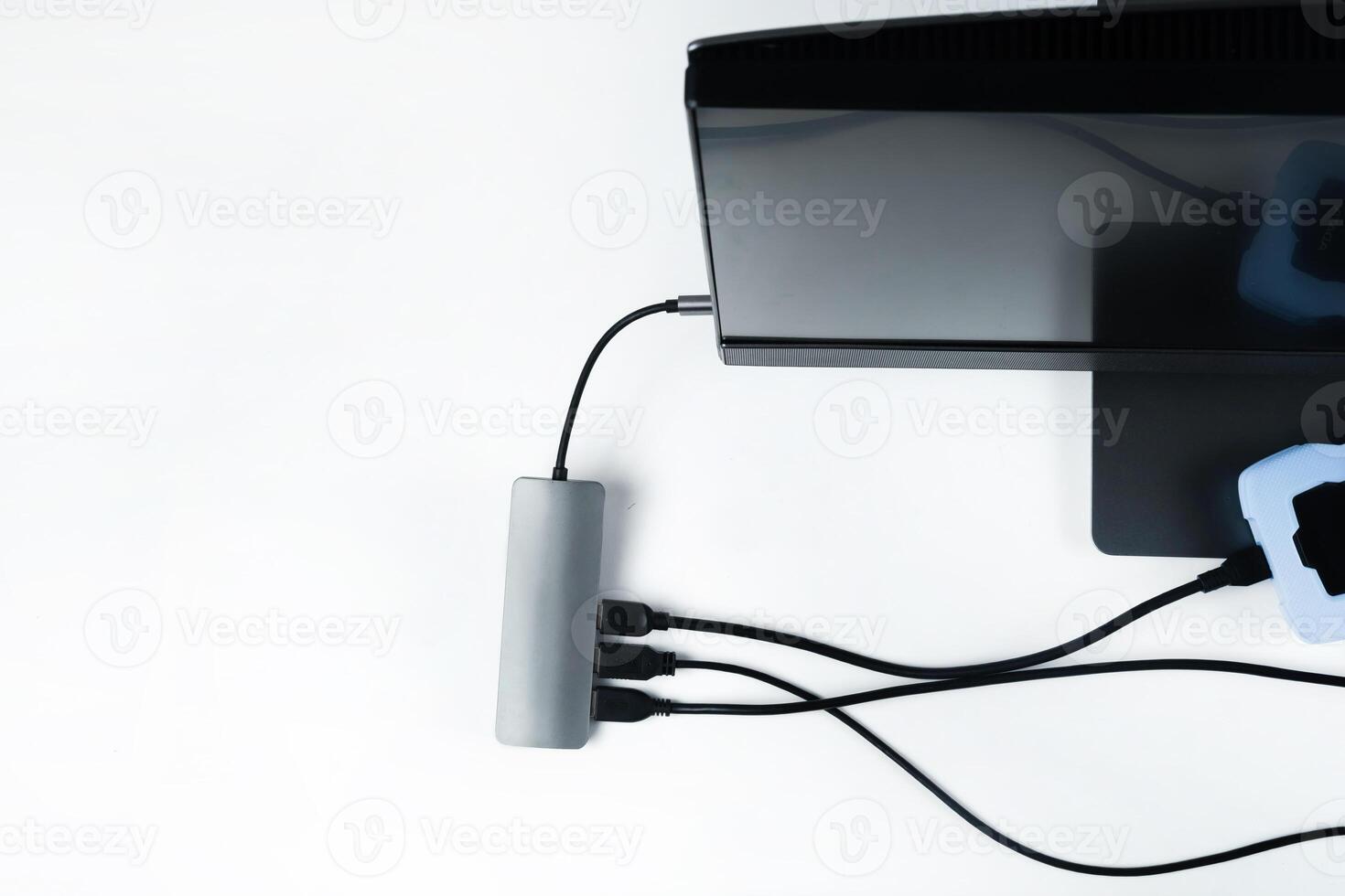 Adapter with connection of external hard drives connected to a monoblock on a white background.Computer with a hard disk photo