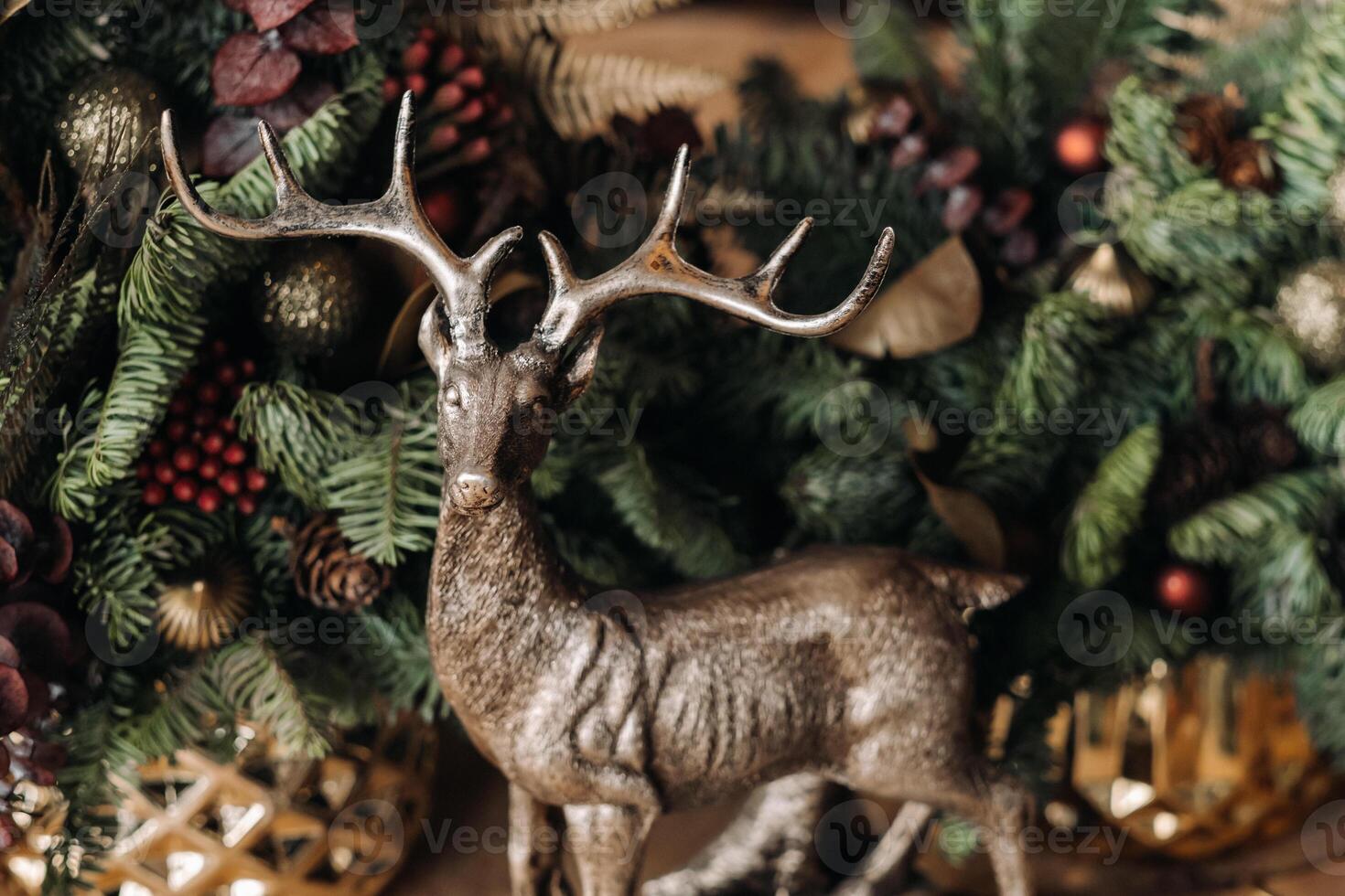 Christmas table decoration, Banquet table with glasses before serving food, Close-up of Christmas dinner table with seasonal decorations, crystal glasses and decorative deer photo