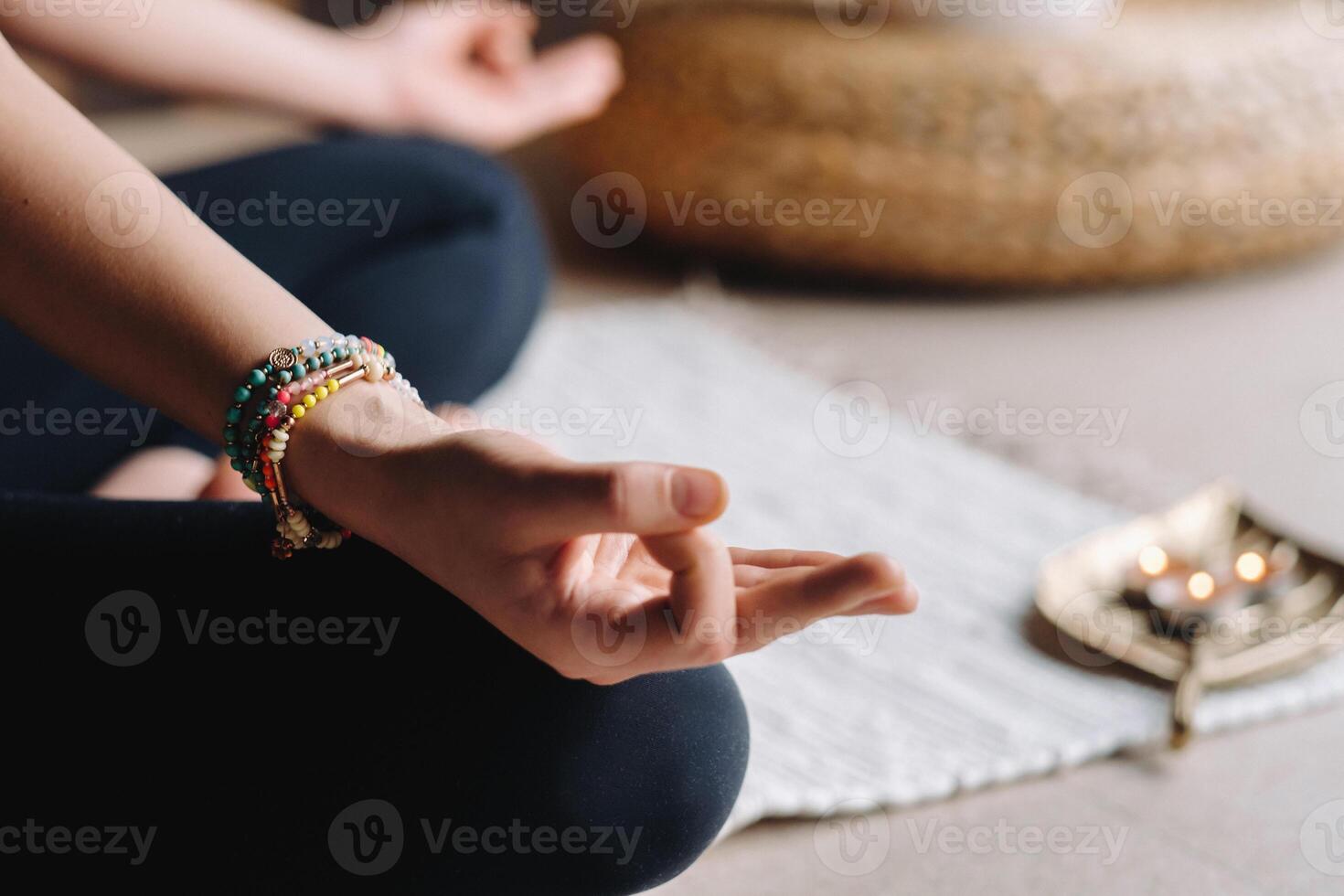 Close-up of a young woman in black clothes doing yoga in a modern gym.The concept of health photo