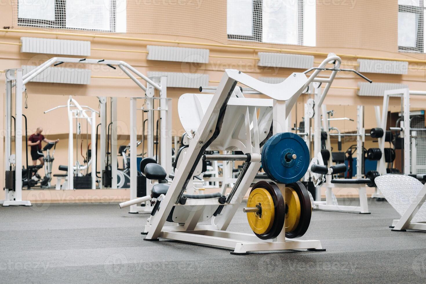 bright gym. Sports equipment in the gym. Bars of different weights on the rack.Trainers photo