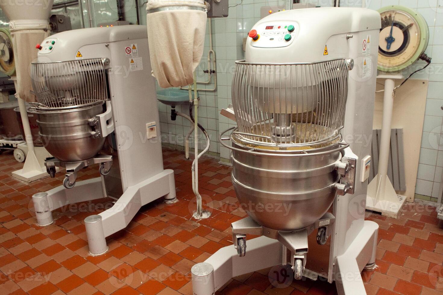 The process of making cookie dough in an industrial kneading machine at the factory photo