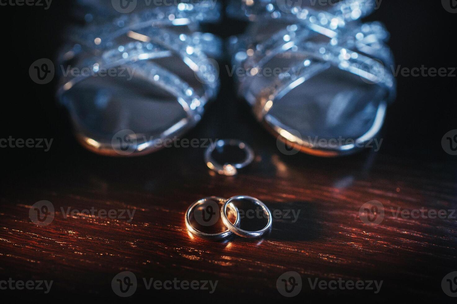 Close-up of two gold wedding rings in a black background.Wedding ring.Wedding rings photo