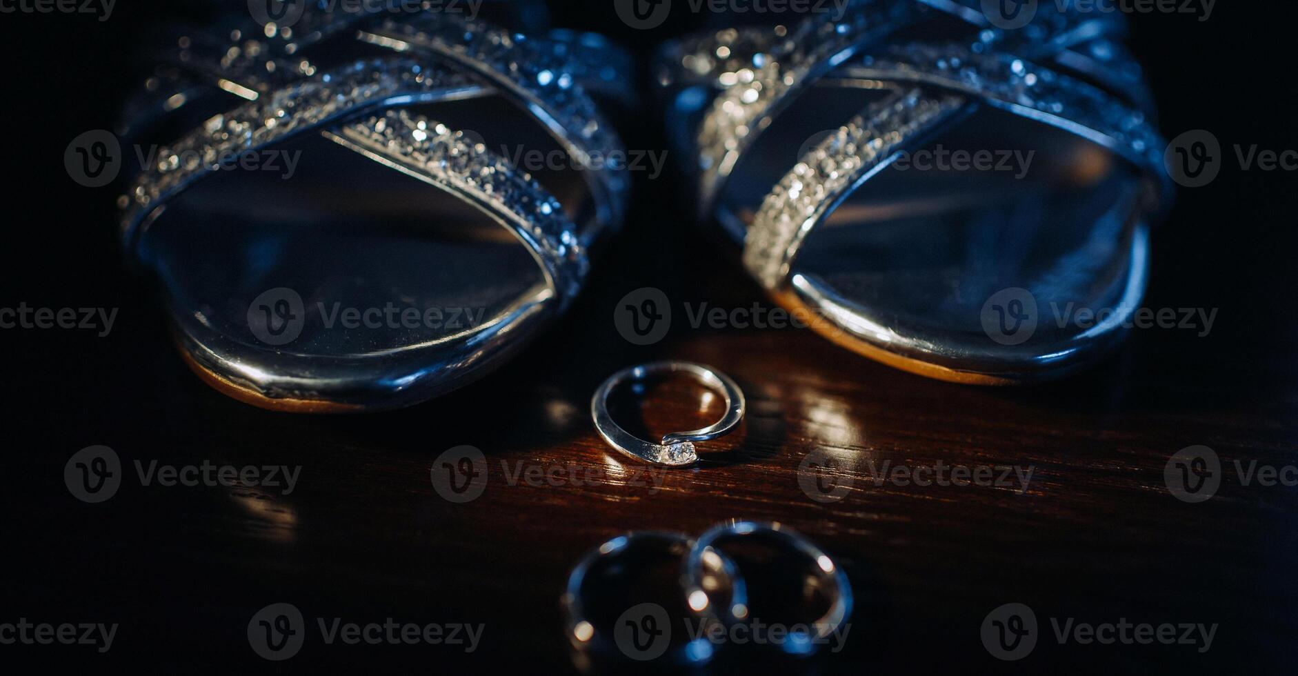 Close-up of two gold wedding rings in a black background.Wedding ring.Wedding rings photo