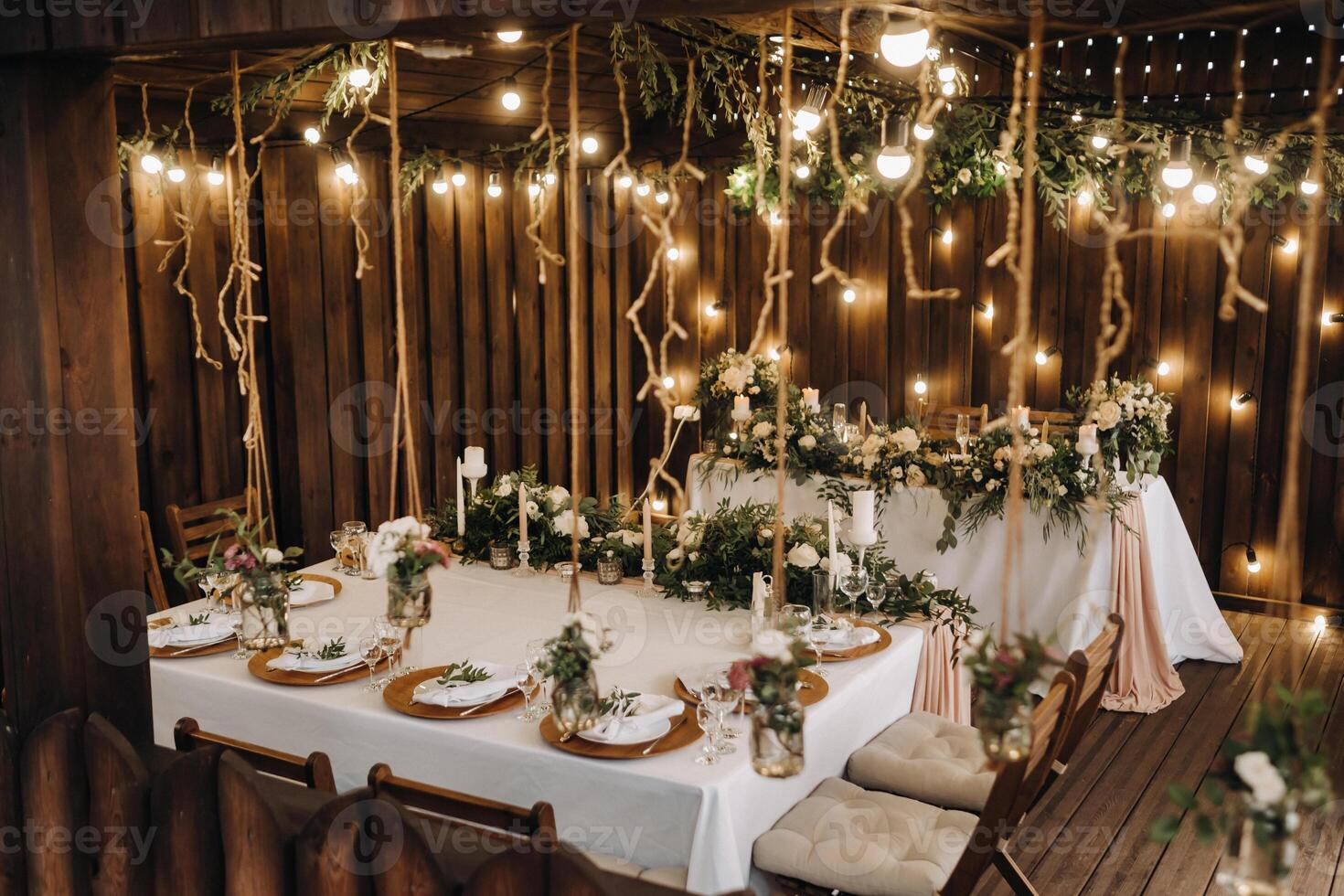 wedding table decoration with flowers on the table in the castle, table decor for dinner by candlelight.Dinner with candles photo