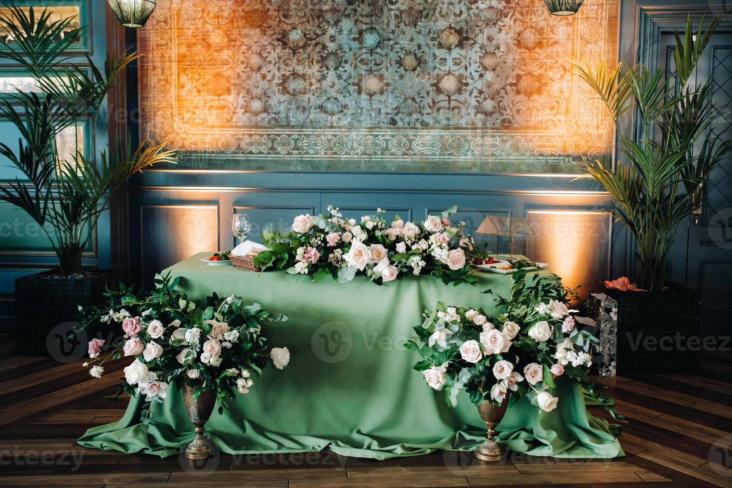 wedding table decoration with flowers on the table in the castle, table decor for dinner by candlelight.Dinner with candles photo