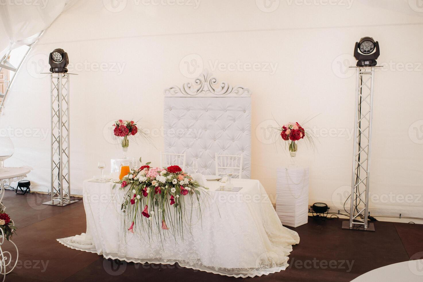 wedding table decoration with flowers on the table in the castle, table decor for dinner by candlelight.Dinner with candles photo