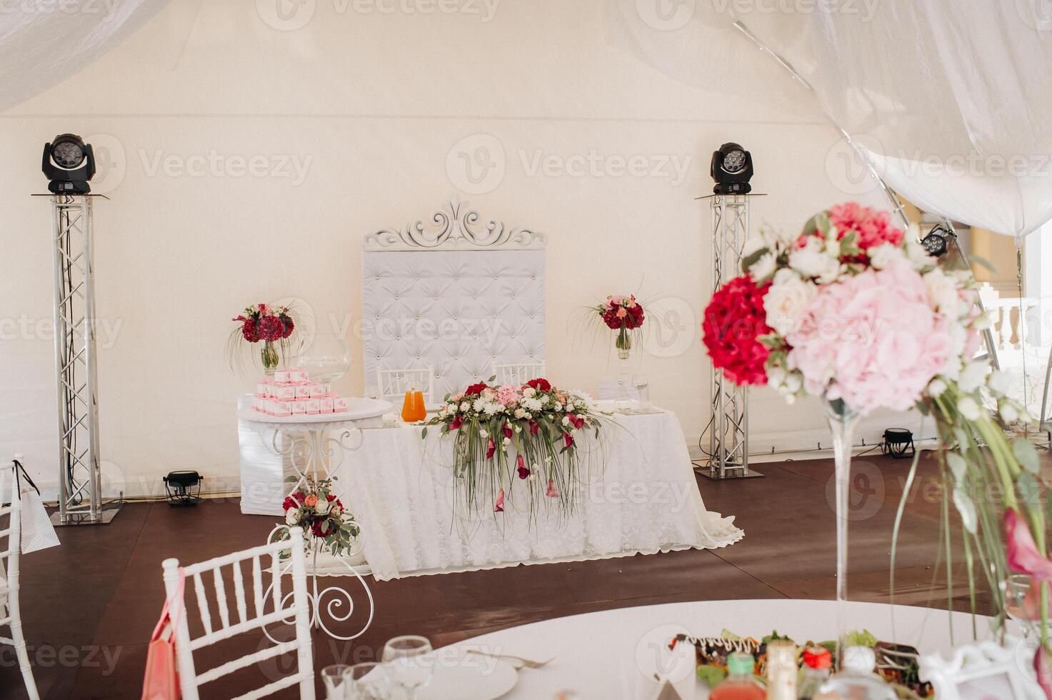 wedding table decoration with flowers on the table in the castle, table decor for dinner by candlelight.Dinner with candles photo