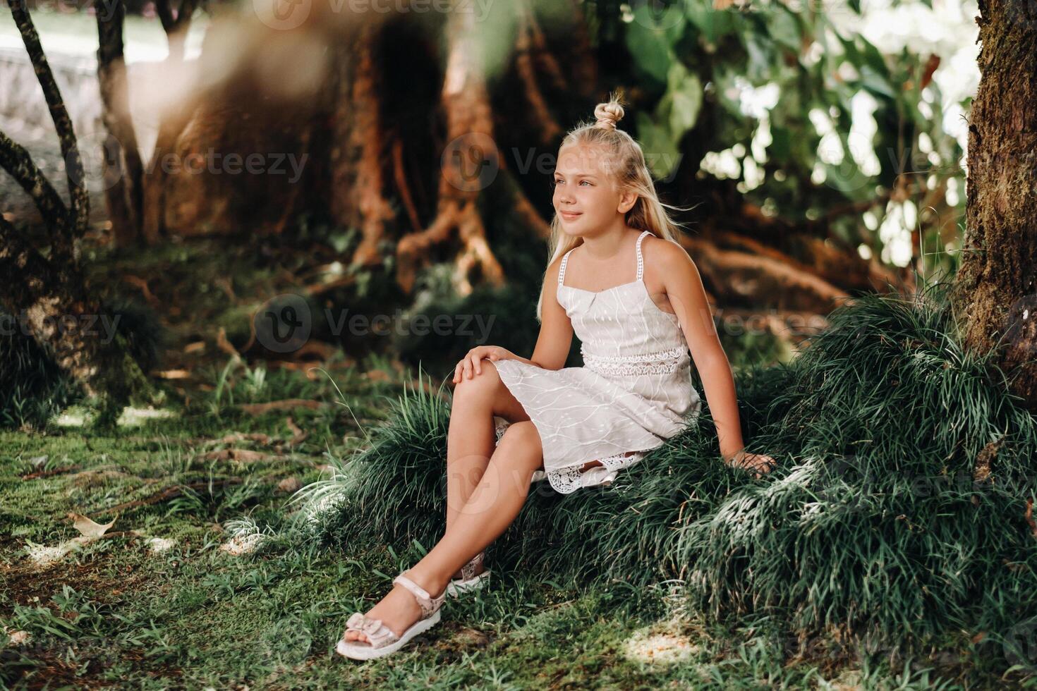 Summer portrait of a happy little girl on the island of Mauritius.beautiful smile, summer white dress. photo