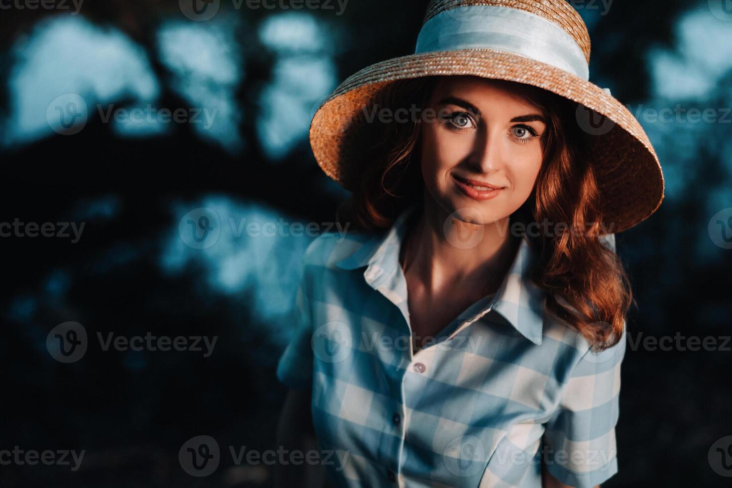 Portrait of a beautiful young lady in a straw hat photo