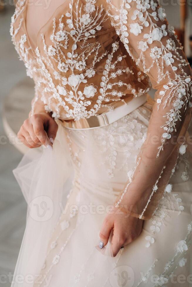 A luxurious bride in a wedding dress in the morning in her interior photo