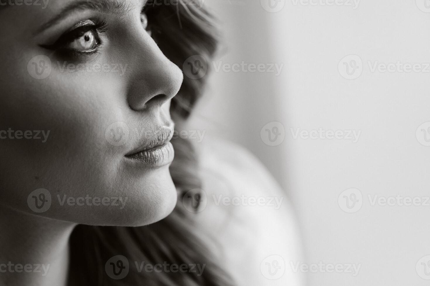 Close-up portrait of a luxurious bride in a wedding dress in the morning in her interior photo