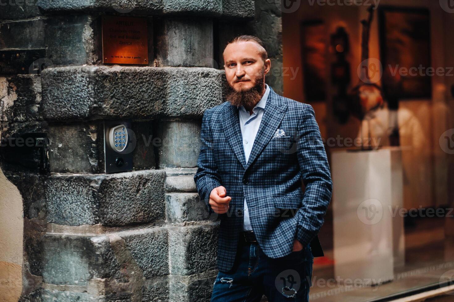 Bearded man in a suit in the old city of Lyon, stylish man in a suit in France photo