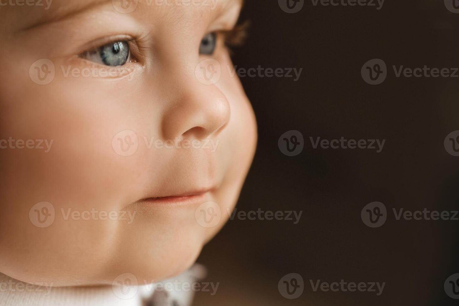 Close-up of a cheerful little boy in the background photo