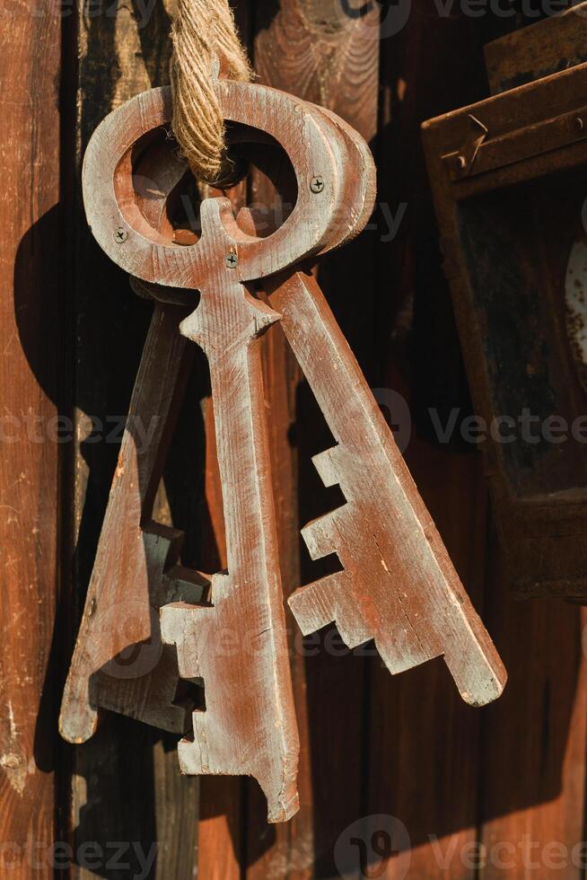 A bunch of old wooden keys hanging on a rope, close-up photo