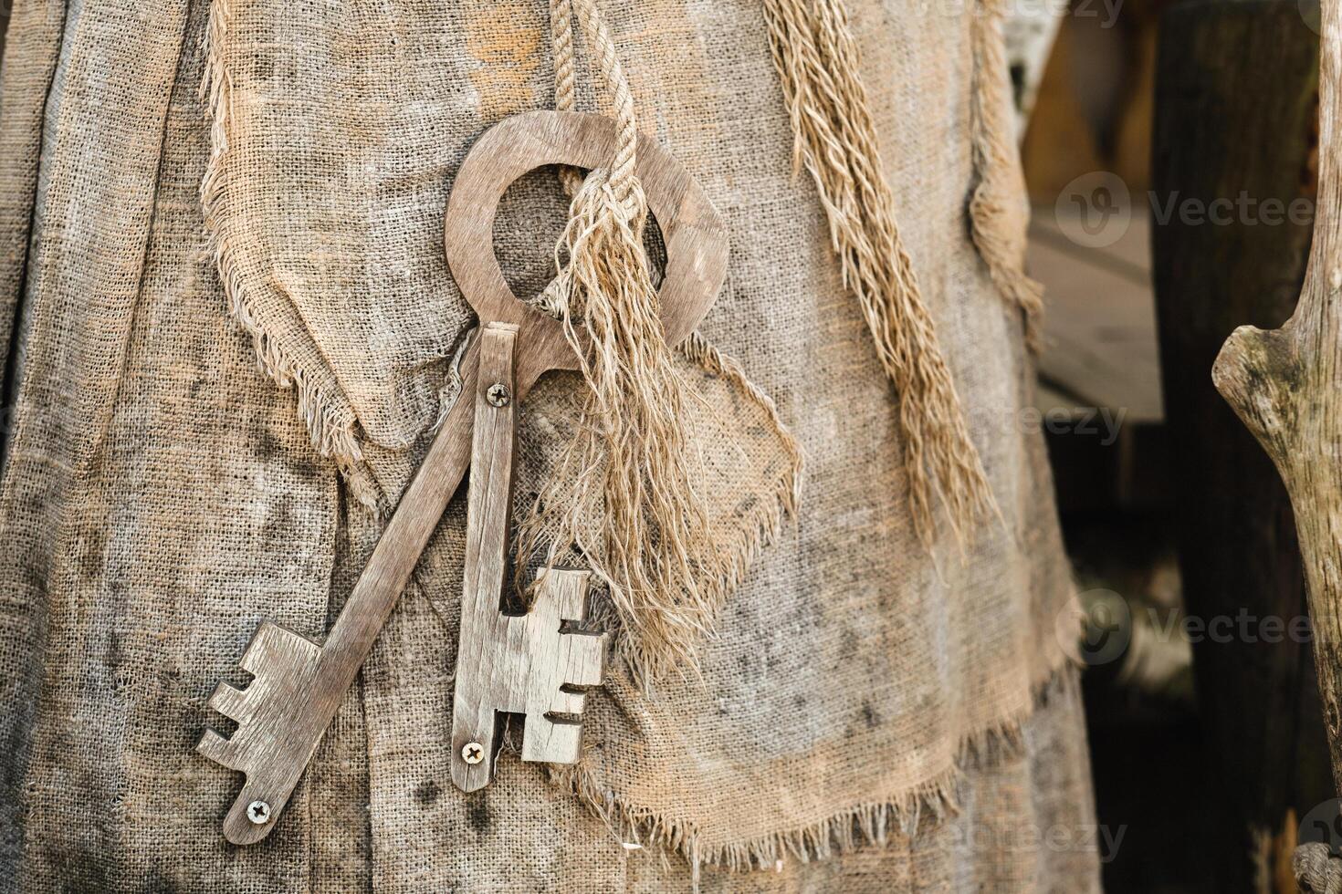 A bunch of old wooden keys hanging on a rope, close-up photo