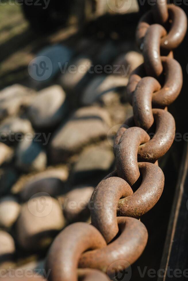 Old rusty metal chain outdoors. Large chain links photo