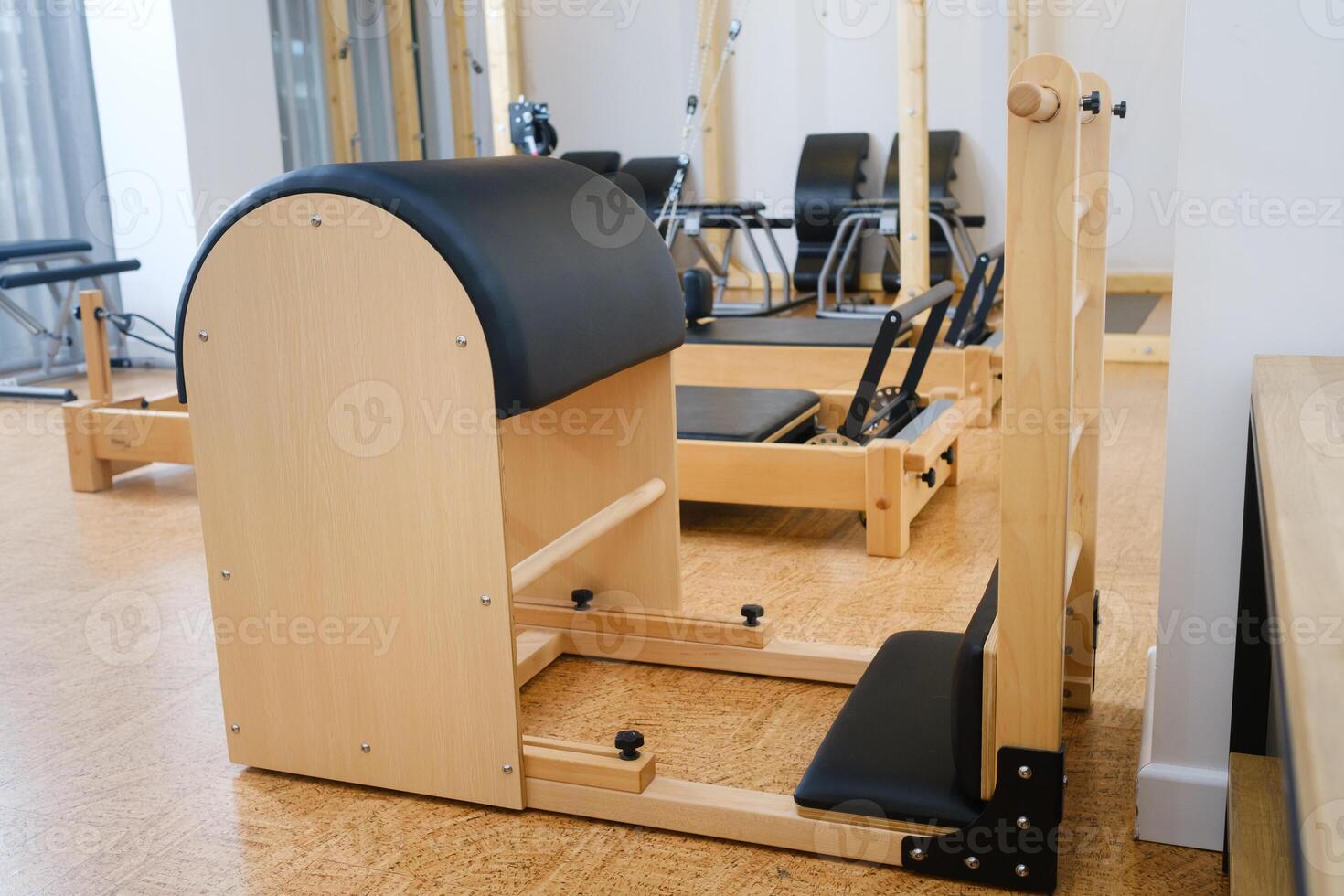 Pilates simulator is a barrel in the yoga room. Pilates equipment photo