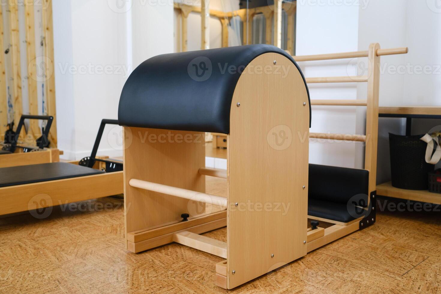Pilates simulator is a barrel in the yoga room. Pilates equipment photo