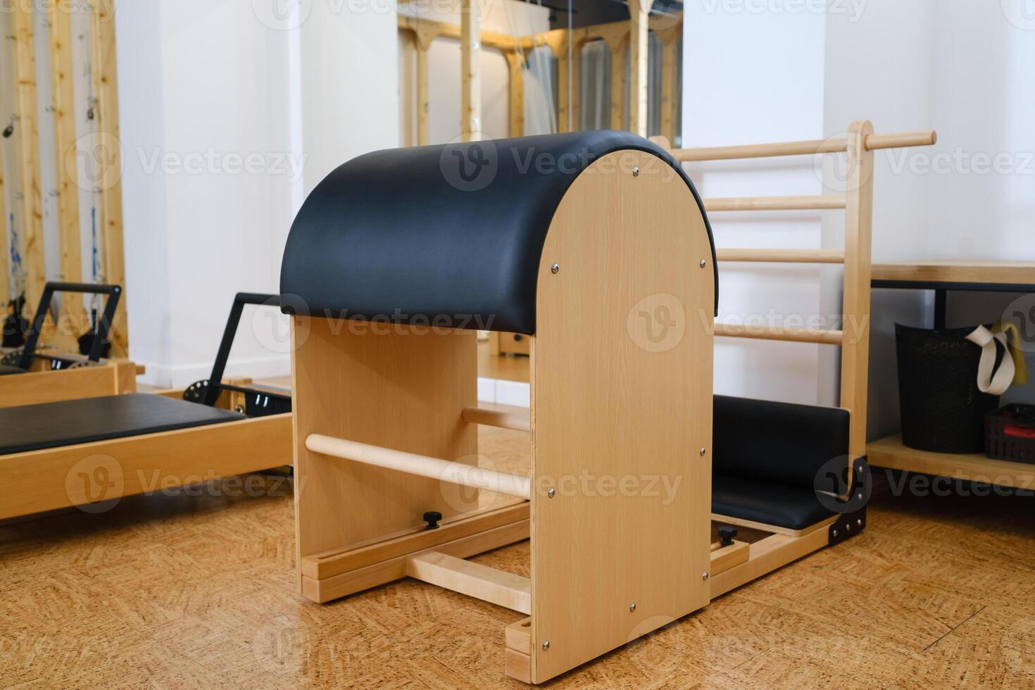 Pilates simulator is a barrel in the yoga room. Pilates equipment photo