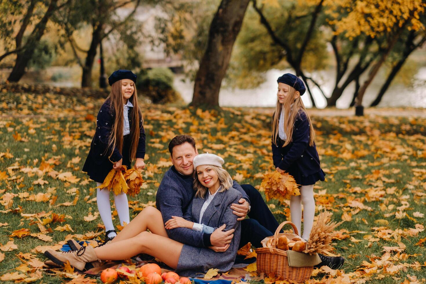 A big family on a picnic in the fall in a nature park. Happy people in the autumn park photo