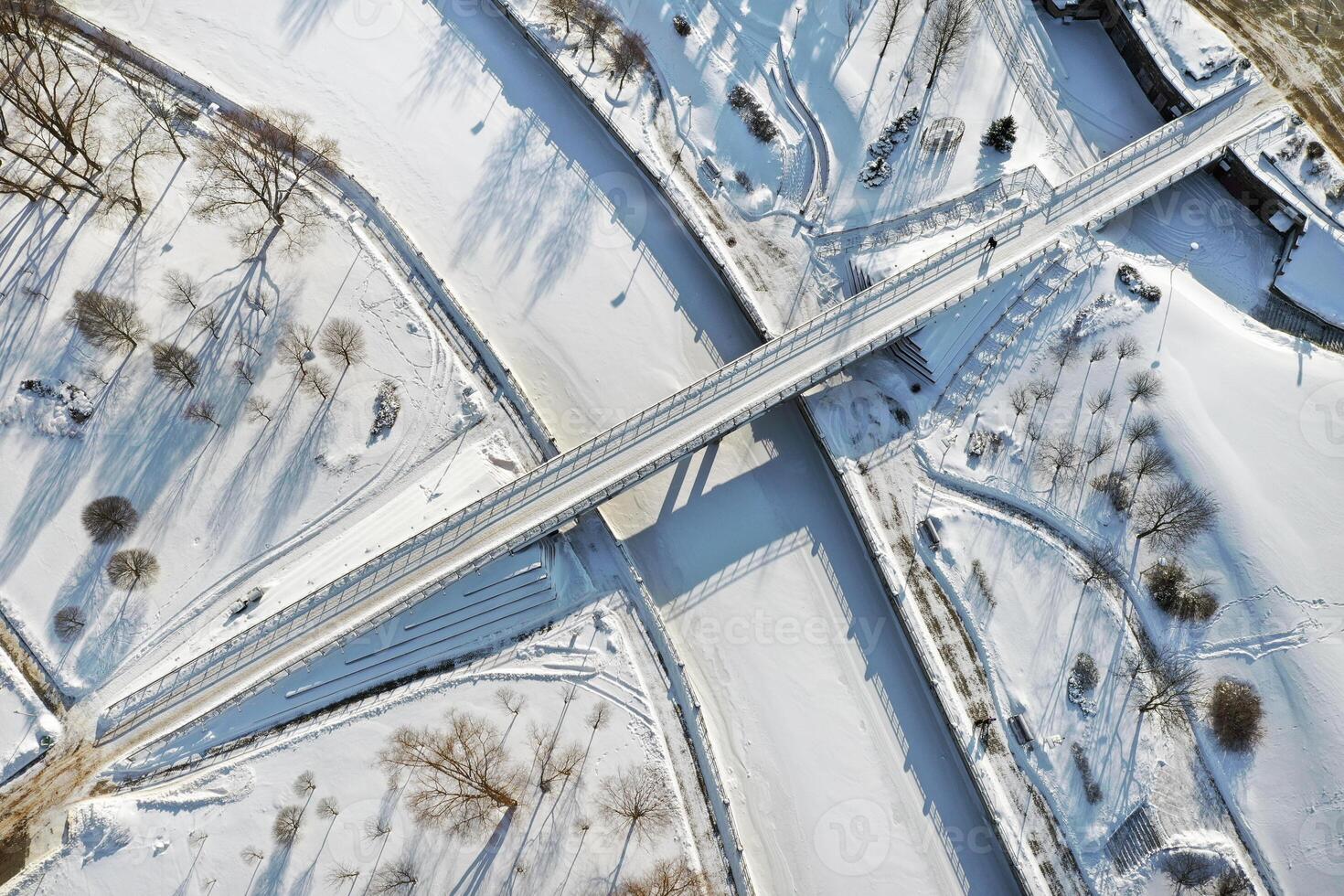 Top view of the pedestrian bridge over the frozen Svisloch river in Minsk. Belarus photo