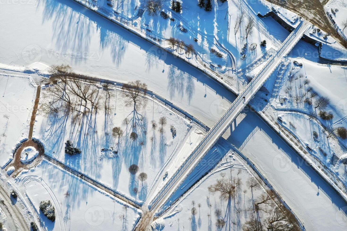 Top view of the pedestrian bridge over the frozen Svisloch river in Minsk. Belarus photo