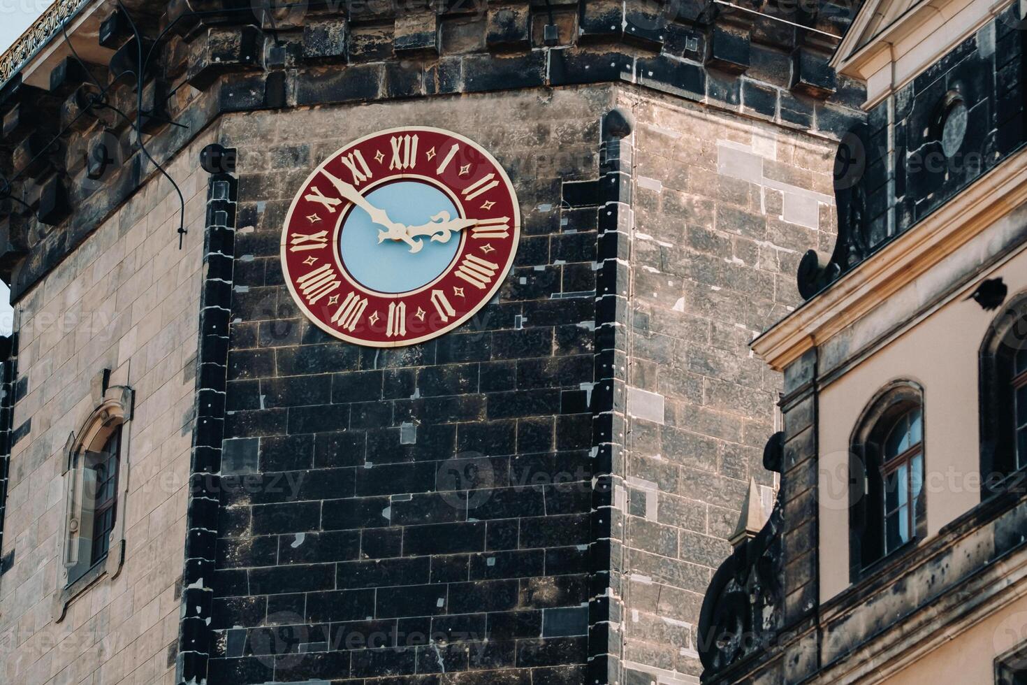 Dresden, the red great clock of the Dresden castle tower, the residence of the old kings in the city center, the Baroque Museum complex, illuminated by the sun photo