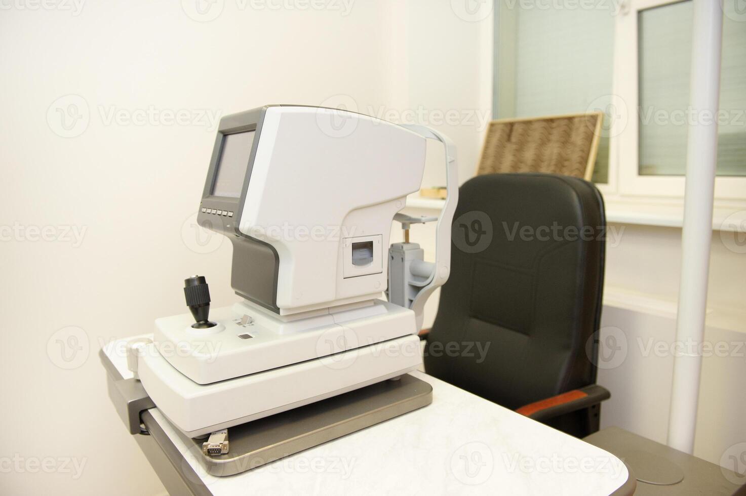The device for checking the vision of a person is in the office of an optometrist photo