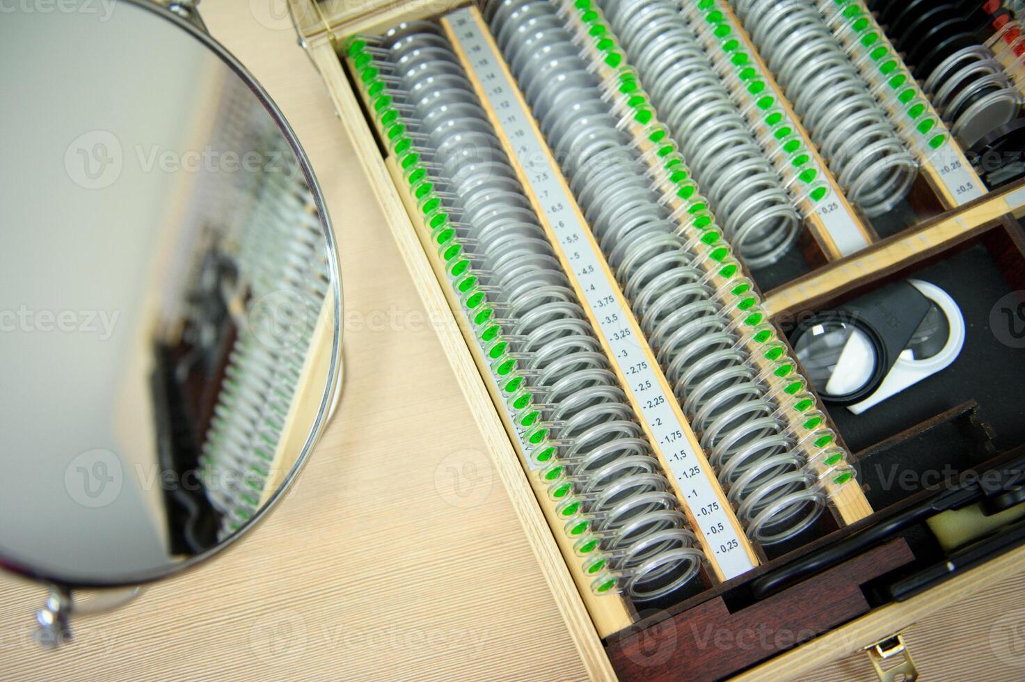 The concept of ophthalmology. The plates contain concave lenses, convex lenses, cylindrical lenses for measuring vision photo