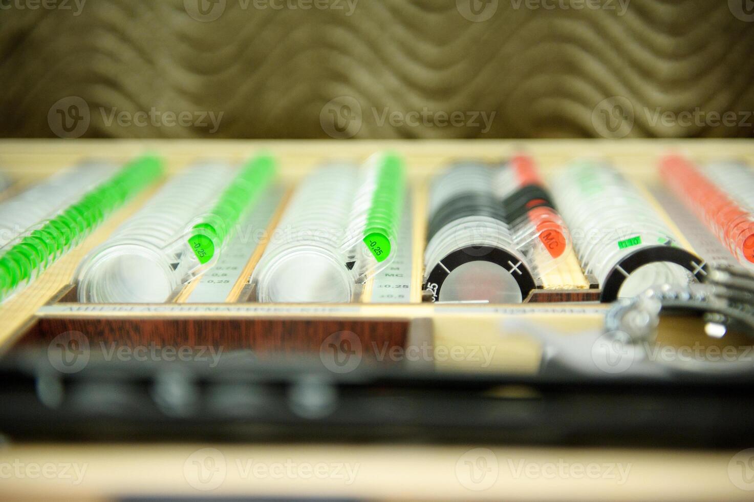 The concept of ophthalmology. The plates contain concave lenses, convex lenses, cylindrical lenses for measuring vision photo