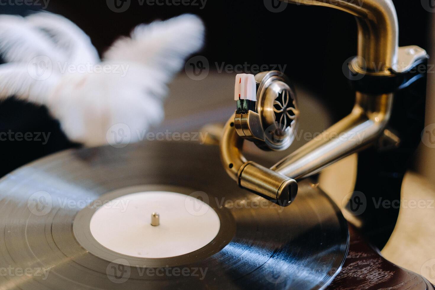 An old retro gramophone is playing a record photo