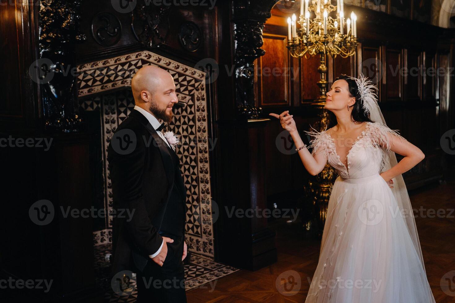 Elegant wedding couple in the interior of the old castle in the city of Nesvizh photo