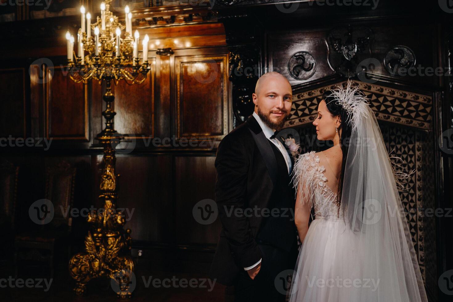 Elegant wedding couple in the interior of the old castle in the city of Nesvizh photo