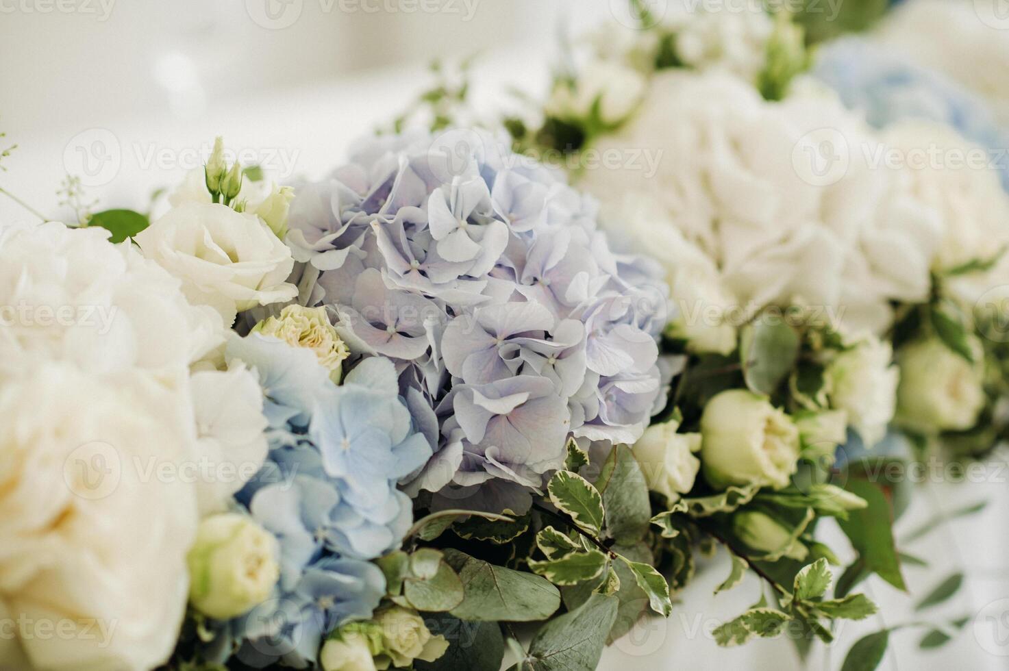 wedding table decoration with blue flowers on the table in the restaurant table decor for dinner at the wedding. photo
