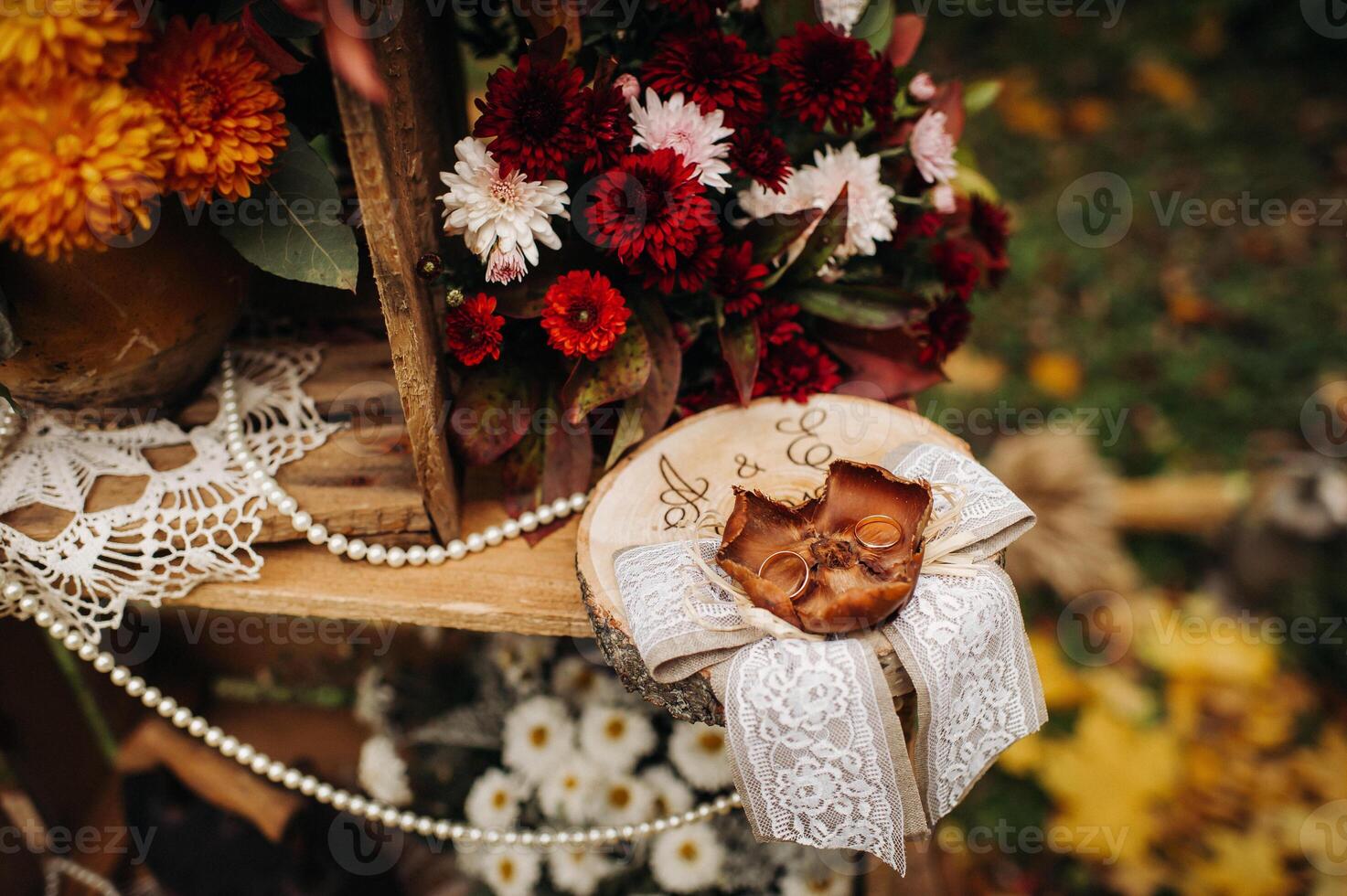 Autumn wedding ceremony on the street on the green lawn.Decor with arches of fresh flowers for the ceremony photo