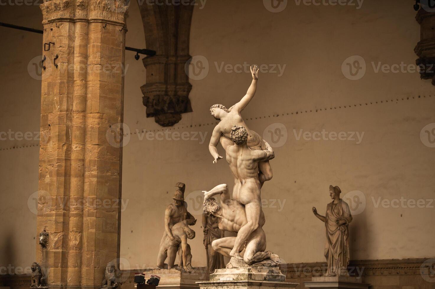 Sculpture of Loggia dei Lanzi and Florence Palazzo Vecchio on Piazza della Signoria in Florence, Italy. Architecture and landmark of Florence. photo