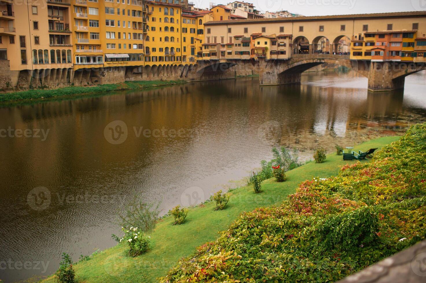 Ponte Vecchio view from Lungarni with Arno river, Spring Sunset in Florence - Italy photo