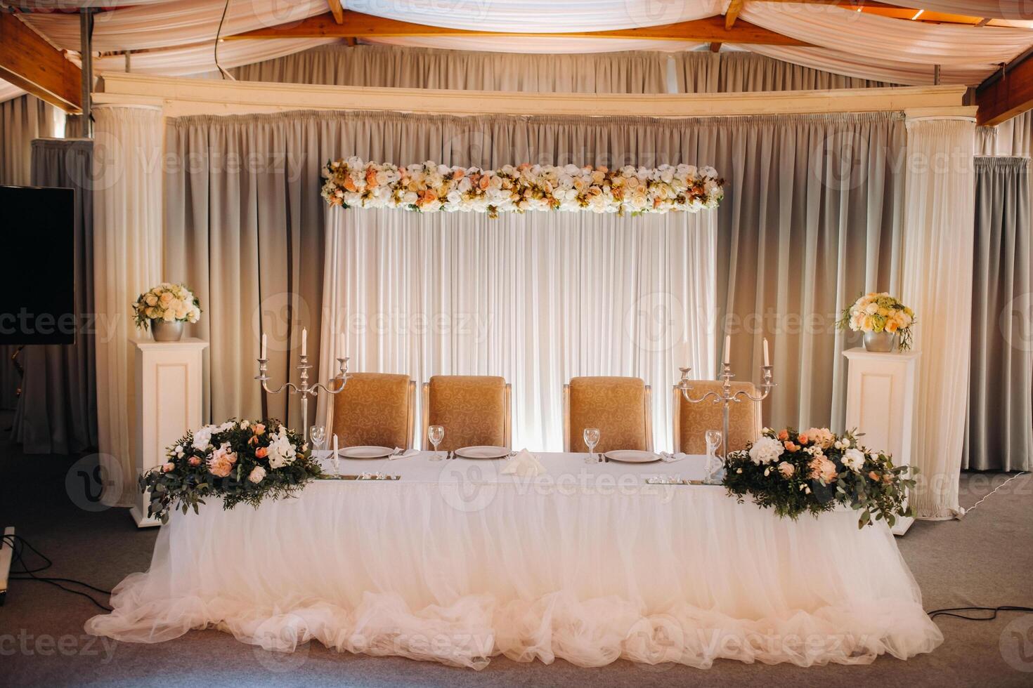 wedding table decoration with flowers on the table in the castle, table decor for dinner by candlelight.Dinner with candles photo
