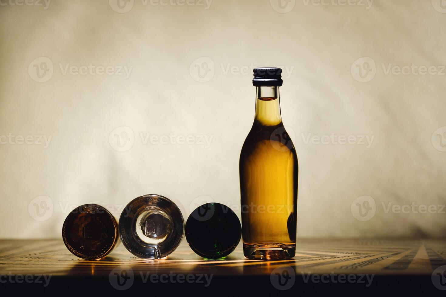 different alcohol bottles are on the table on a light background photo