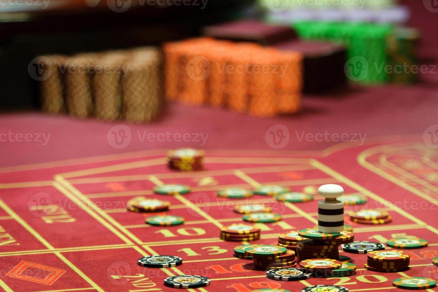close-up of chips on the gaming table in a roulette casino photo