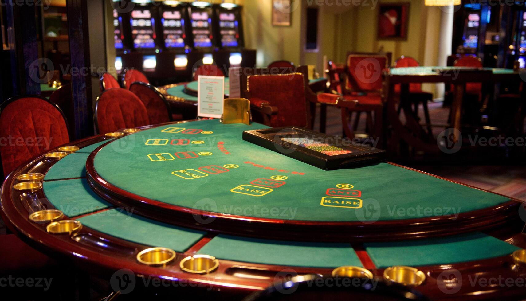 An empty blackjack table in a casino in green tones photo