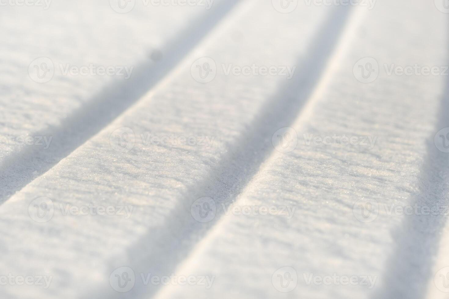 winter background. The texture of snow with stripes. Pure white snow photo