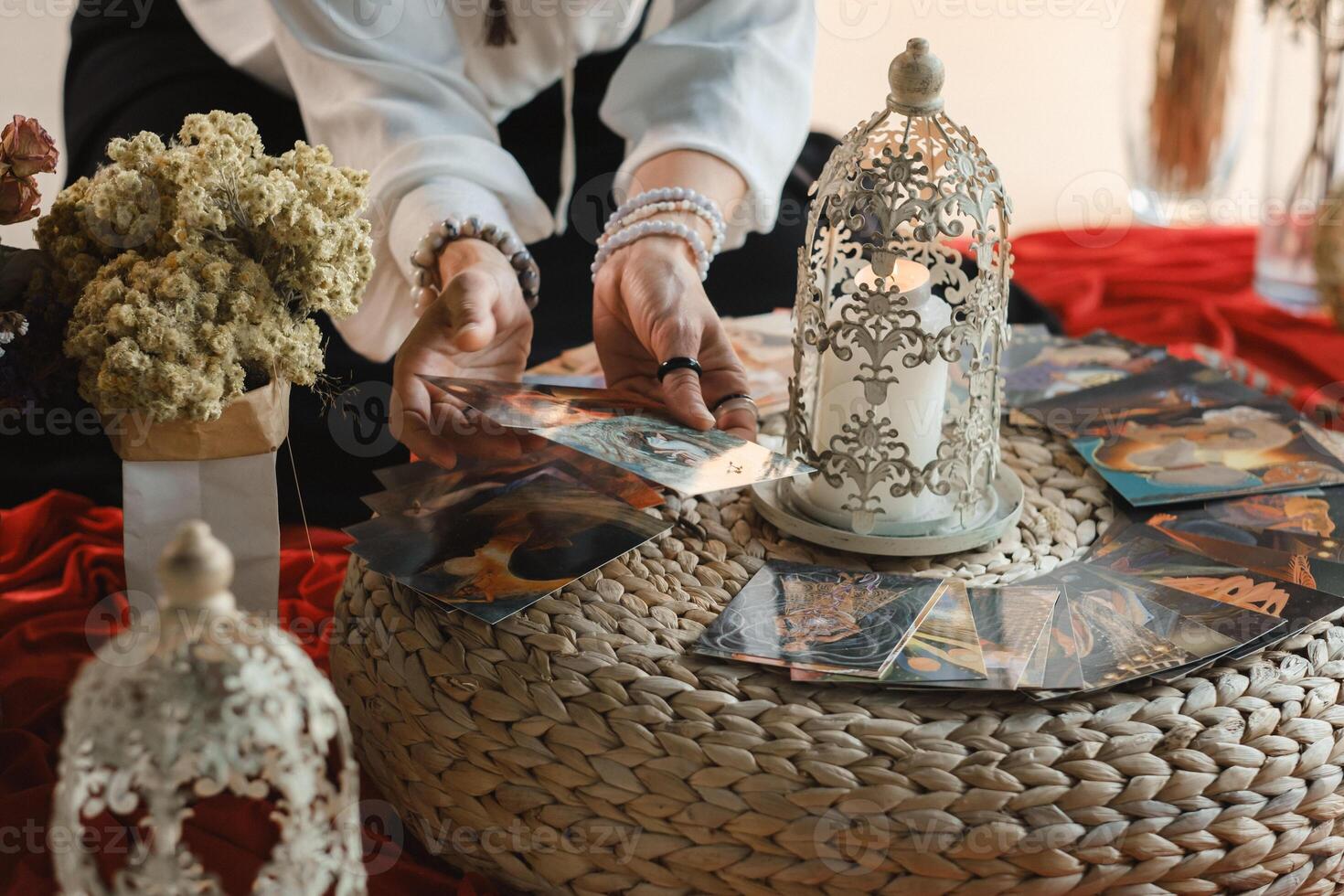 Women's circle and the practice of using metaphorical cards. The girl's hands are holding cards photo