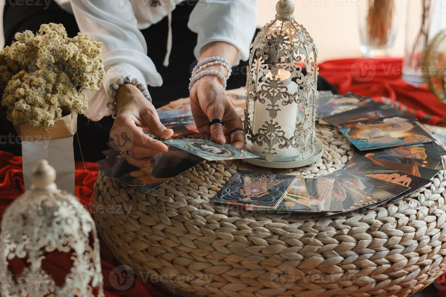 Women's circle and the practice of using metaphorical cards. The girl's hands are holding cards photo