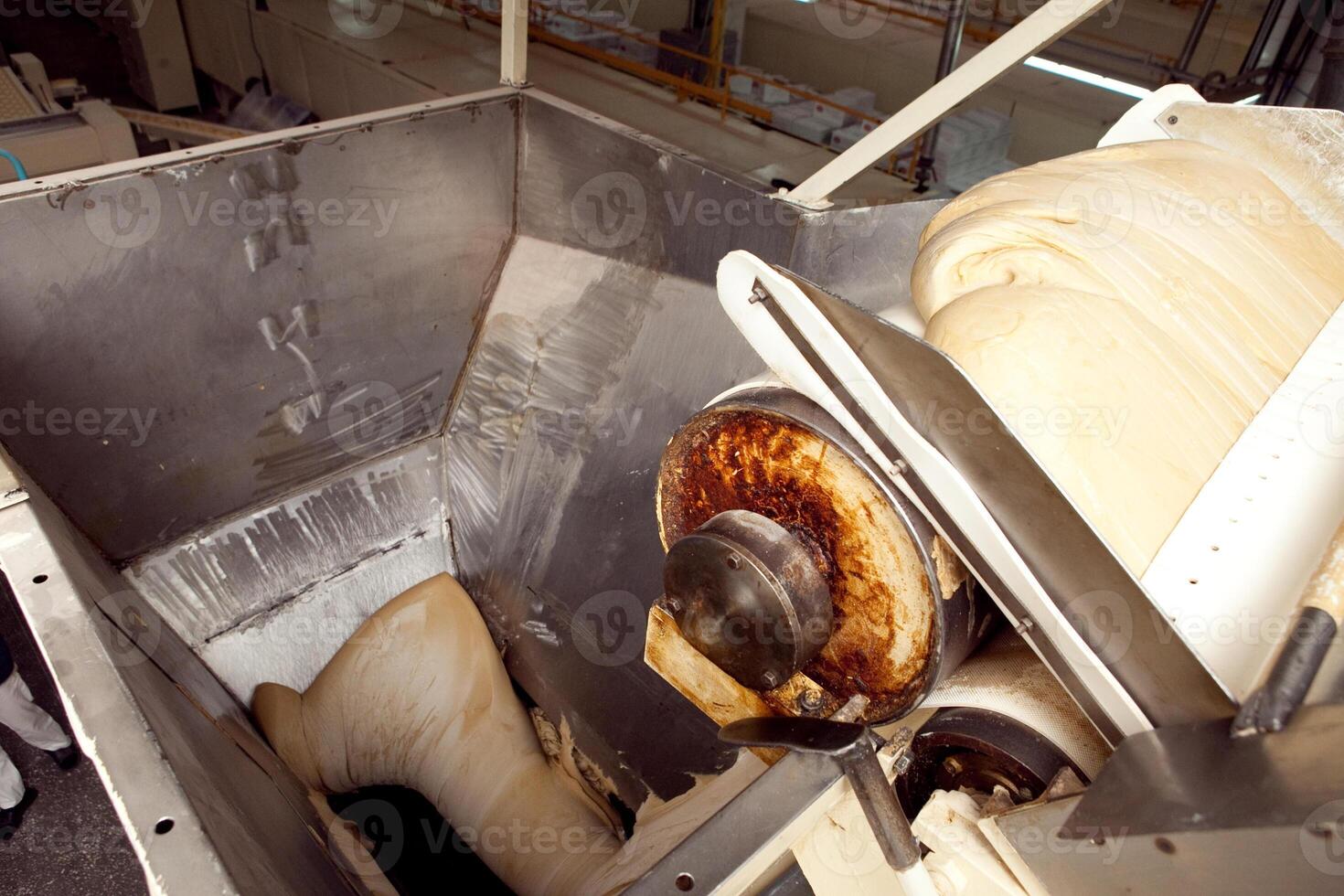 machine for making cookies in the factory. Conveyor belt with Cookie dough photo